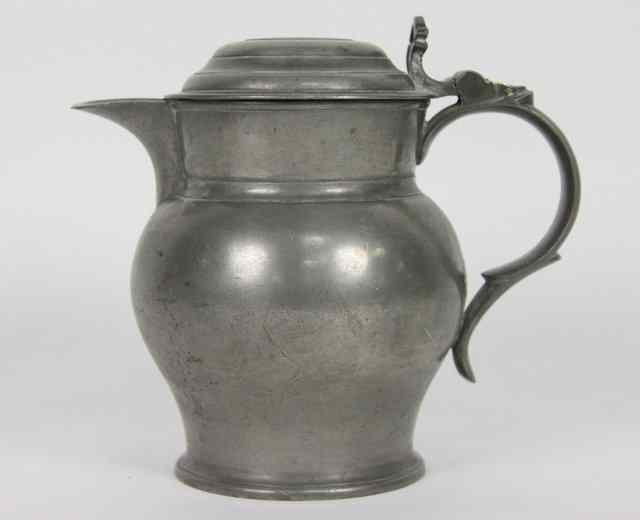 Appraisal: An English pewter late th Century lidded jug with domed