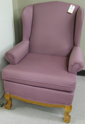 Appraisal: CHIPPENDALE STYLE WINGBACK ARMCHAIR American modern having mauve upholstery and