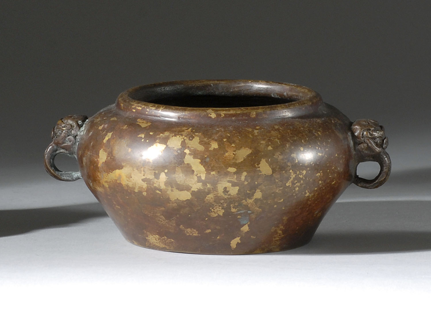 Appraisal: SUNSPOT BRONZE CENSER th CenturyIn ovoid form with mask handles