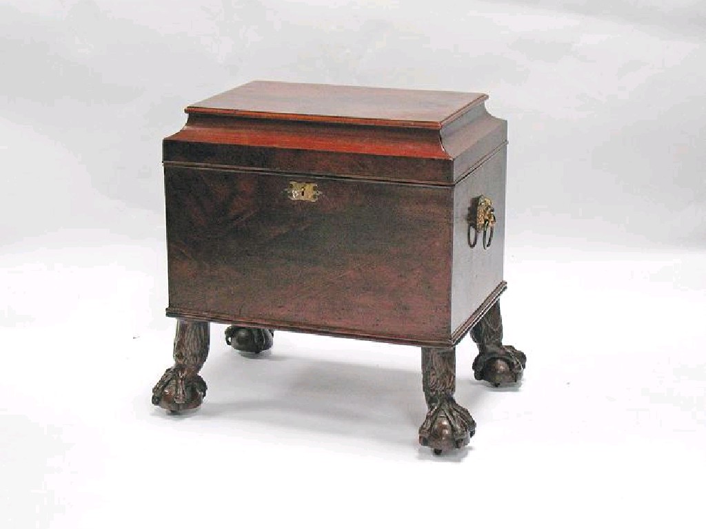 Appraisal: A REGENCY MAHOGANY CELLARETTE with a partitioned interior and lion's