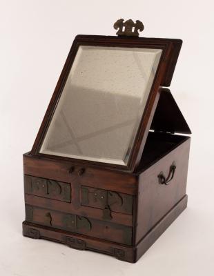 Appraisal: A Chinese hardwood dressing case with brass mounts and an