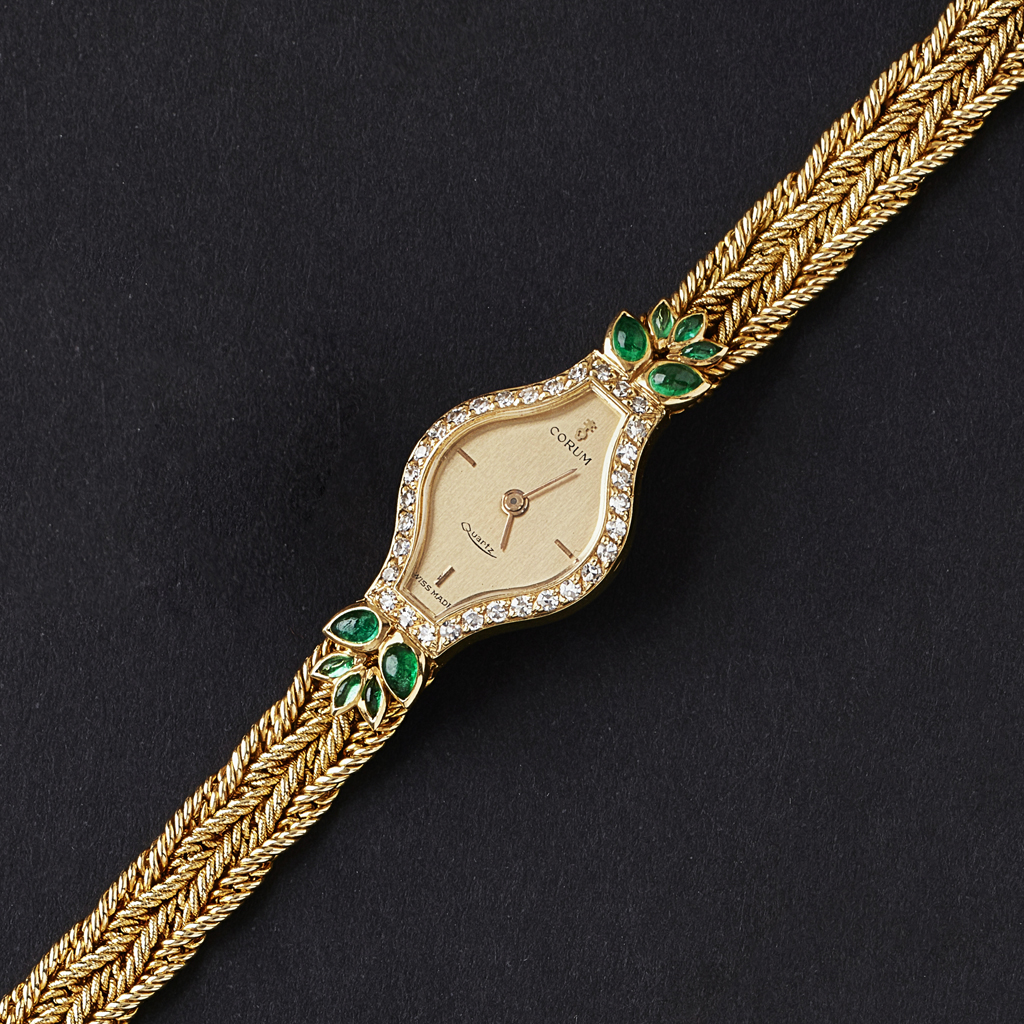 Appraisal: CORUM - A lady's emerald and diamond set cocktail watch