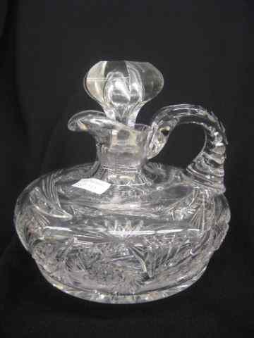 Appraisal: Cut Glass Ship's Decanter pinwheel decor triple notched handles brilliant