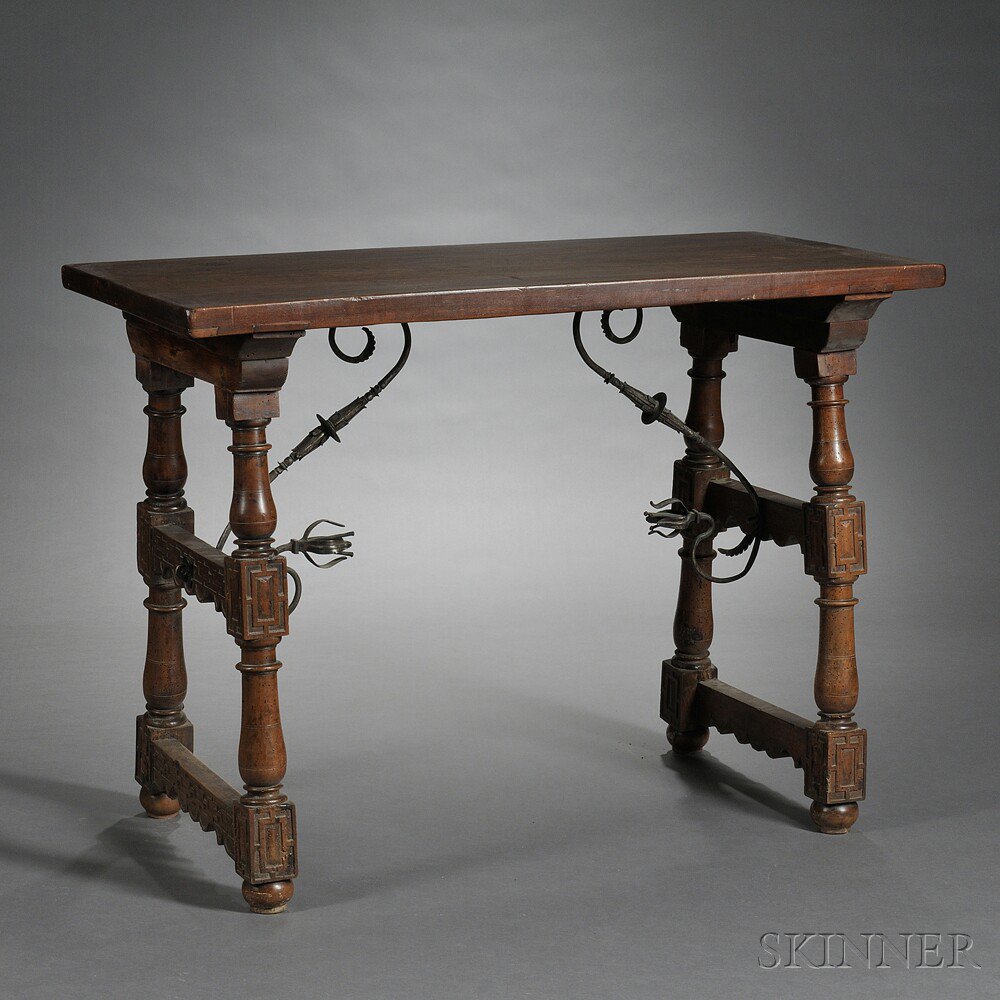 Appraisal: Iberian Walnut Trestle Table the rectangular top on two ring-