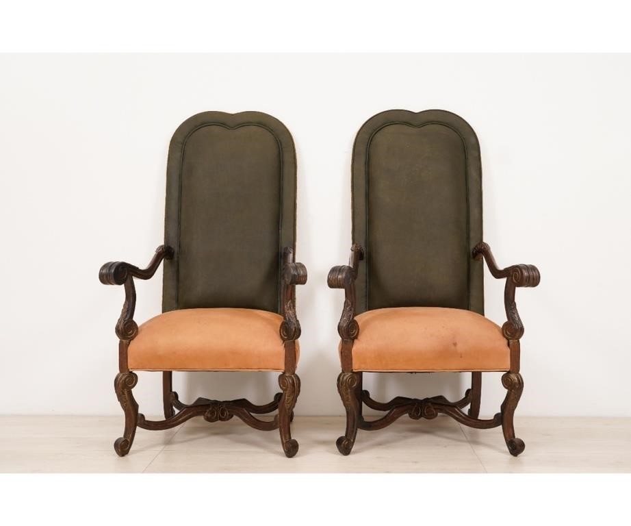 Appraisal: Pair of continental style walnut throne chairs with carved arms