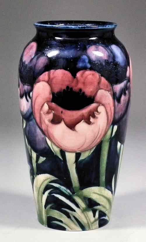 Appraisal: A Moorcroft pottery vase decorated with ''Poppy'' design on a