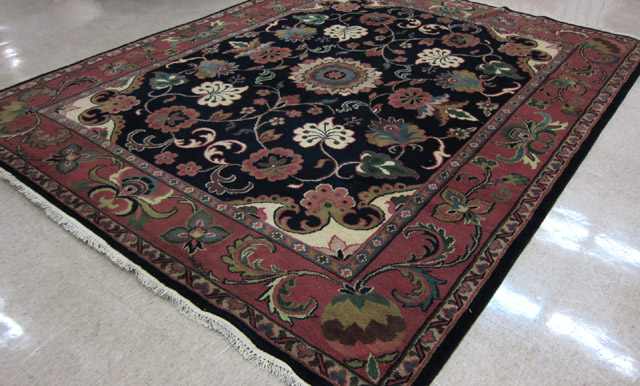 Appraisal: HAND KNOTTED ORIENTAL CARPET Indo-Persian floral and central rosette medallion