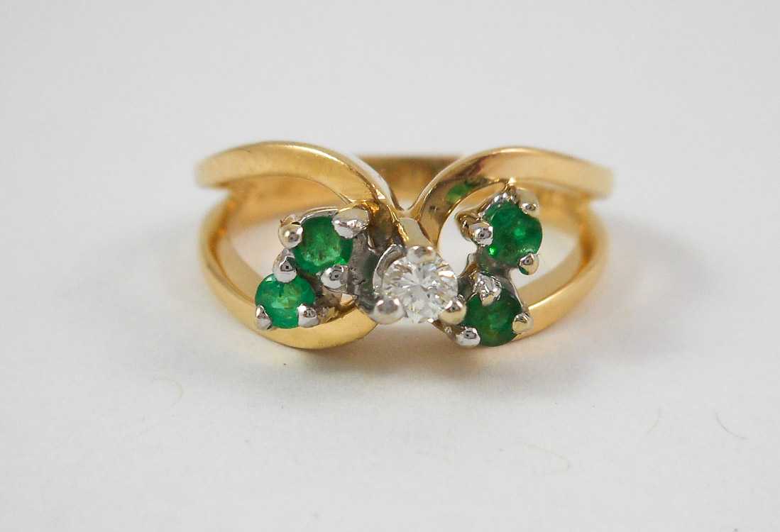 Appraisal: EMERALD DIAMOND AND FOURTEEN KARAT GOLD RING with four round-cut