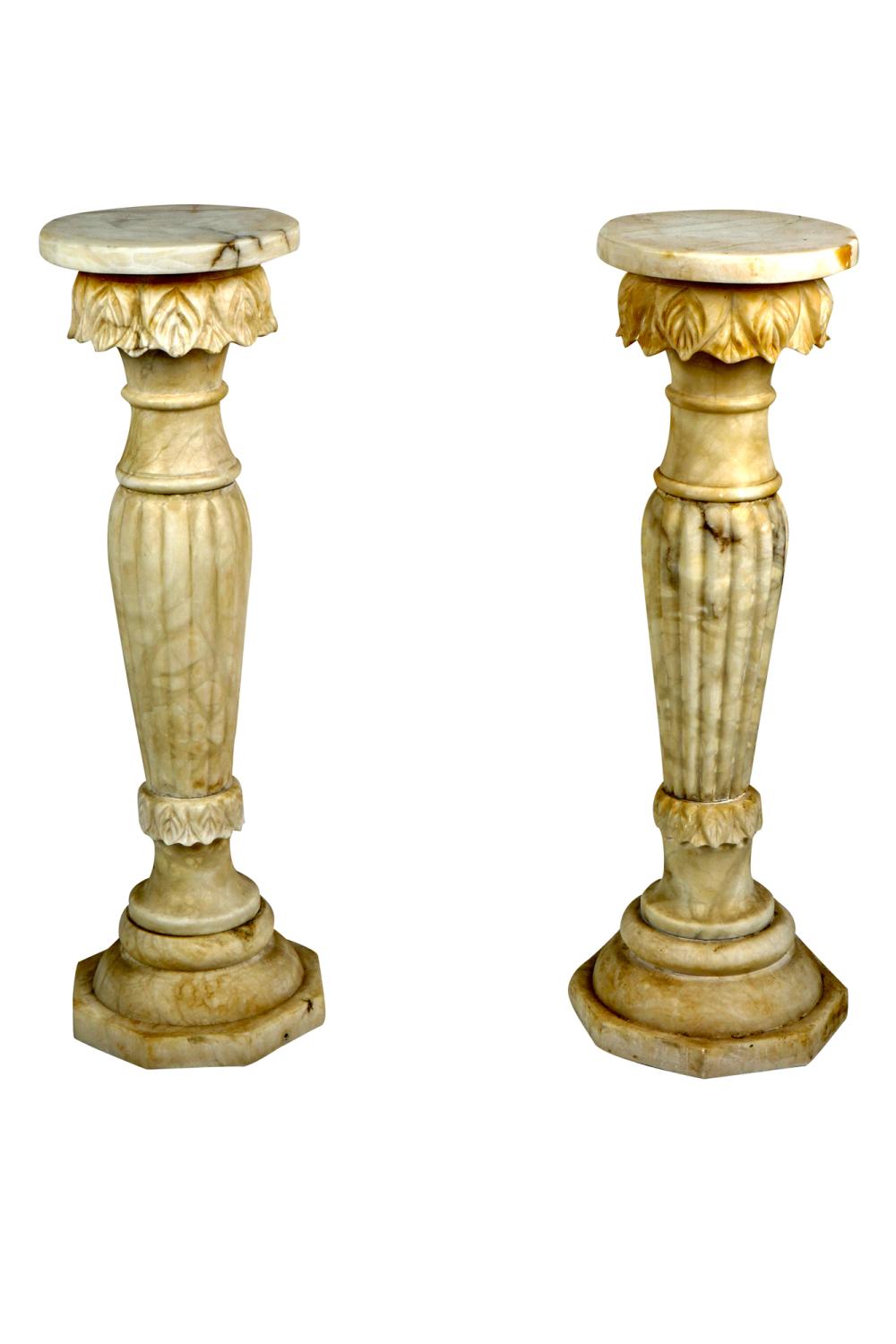 Appraisal: PAIR OF CARVED ALABASTER PEDESTALSeach inches diameter inches high Condition