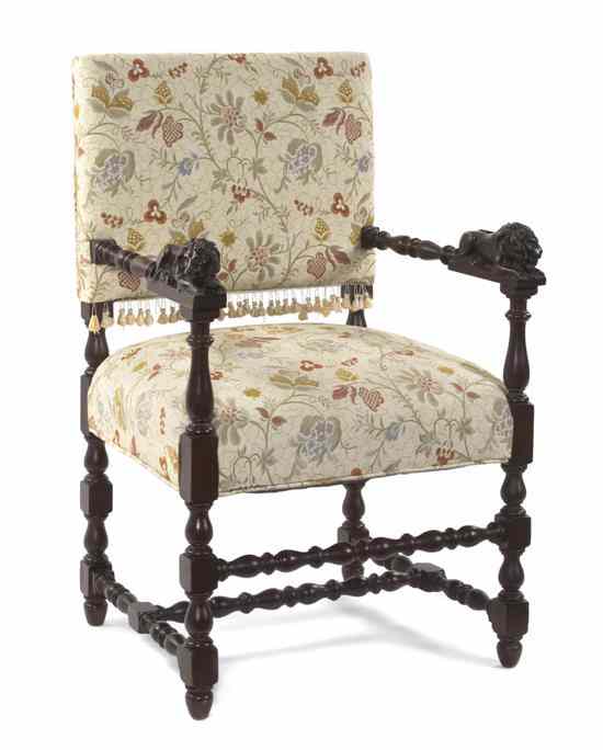 Appraisal: A Renaissance Revival Style Carved Open Armchair having an upholstered