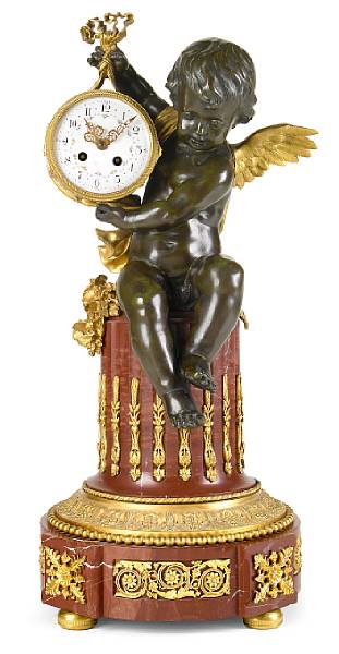 Appraisal: A French gilt and patinated bronze and rouge marble clock