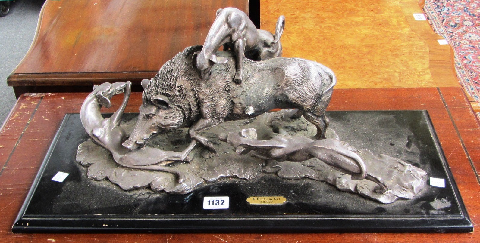 Appraisal: A silver coated plaster model of a wild boar being