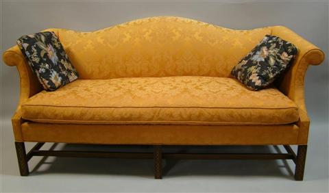 Appraisal: CHIPPENDALE STYLE MAHOGANY CAMEL BACK SOFA the padded back with