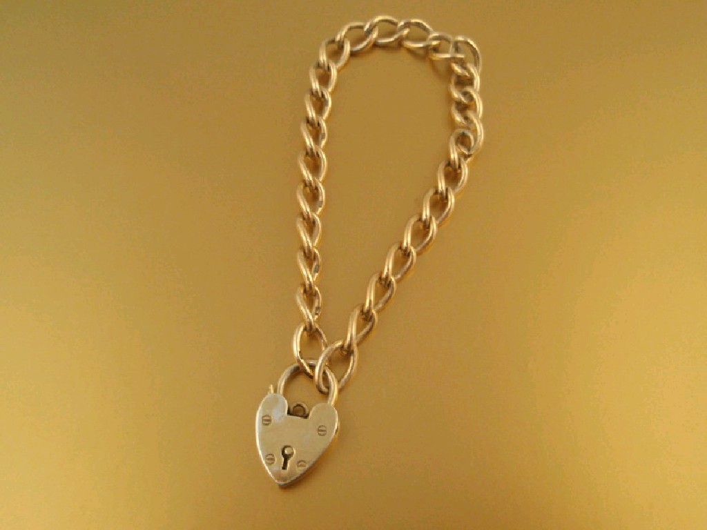 Appraisal: A ct gold curb link bracelet with padlock clasp g