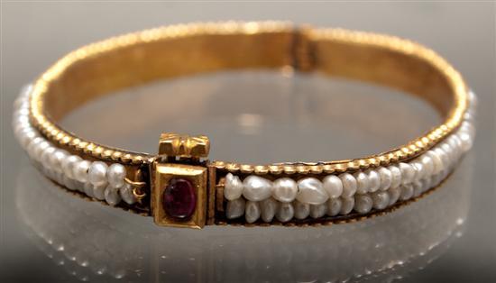 Appraisal: Victorian yellow gold seed pearl and cabochon ruby bangle bracelet