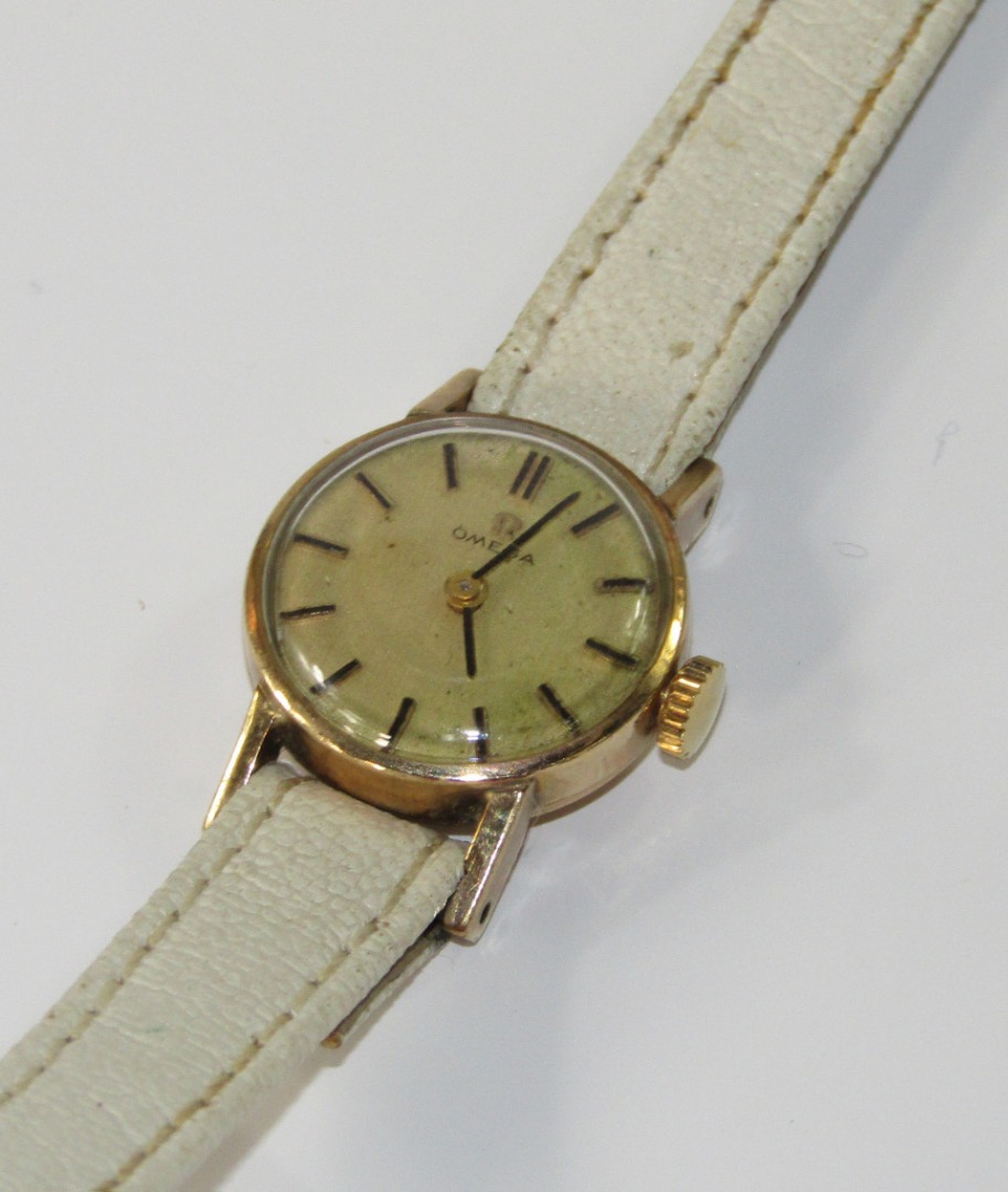 Appraisal: An Omega ct gold lady's wristwatch with champagne dial and