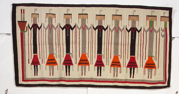 Appraisal: A Navajo Yei rug With eight Yei figures trailing lengthy