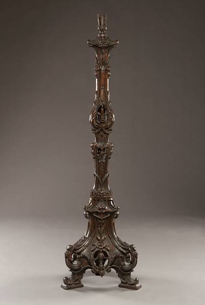 Appraisal: An Italian Rococo style walnut floor torchere second half th