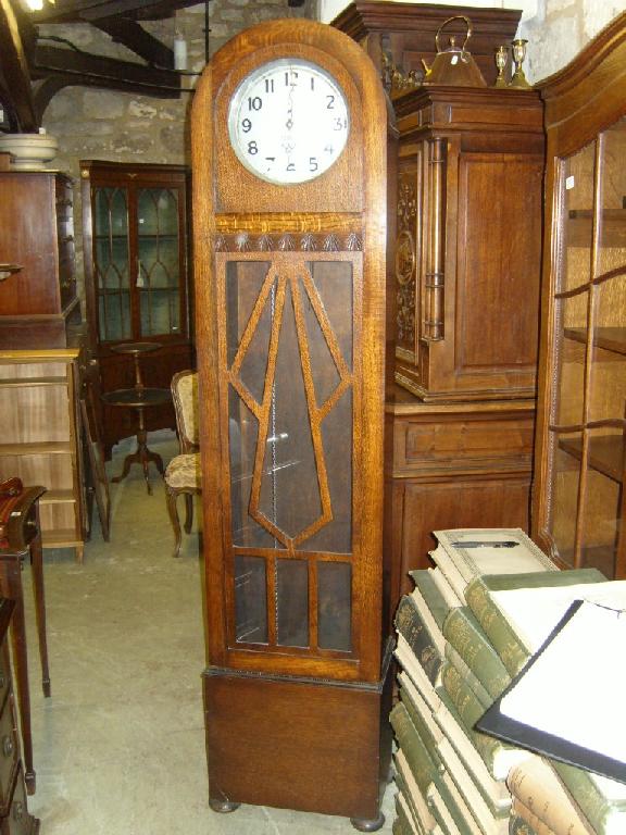 Appraisal: A 's oak cigar shaped longcase clock with silvered dial