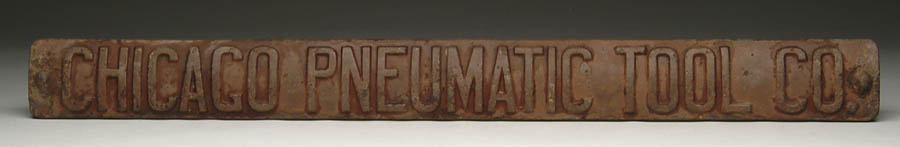 Appraisal: CAST IRON ADVERTISING PIECE FOR CHICAGO PNEUMATIC TOOL COMPANY Banner-shaped