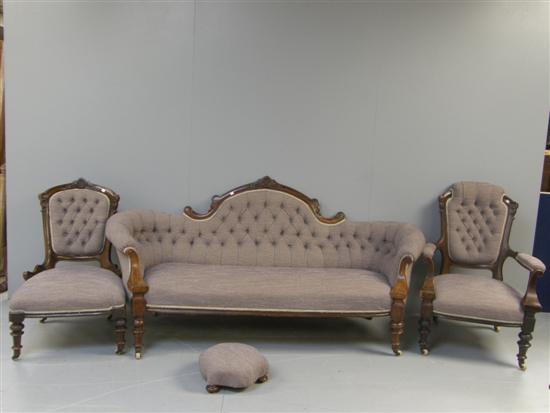 Appraisal: Victorian mahogany framed settee two matching chairs and a footstool