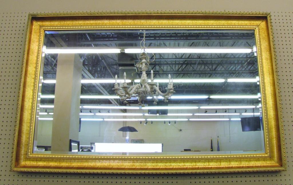 Appraisal: A gold finish wall mirror with beveled glass beaded style