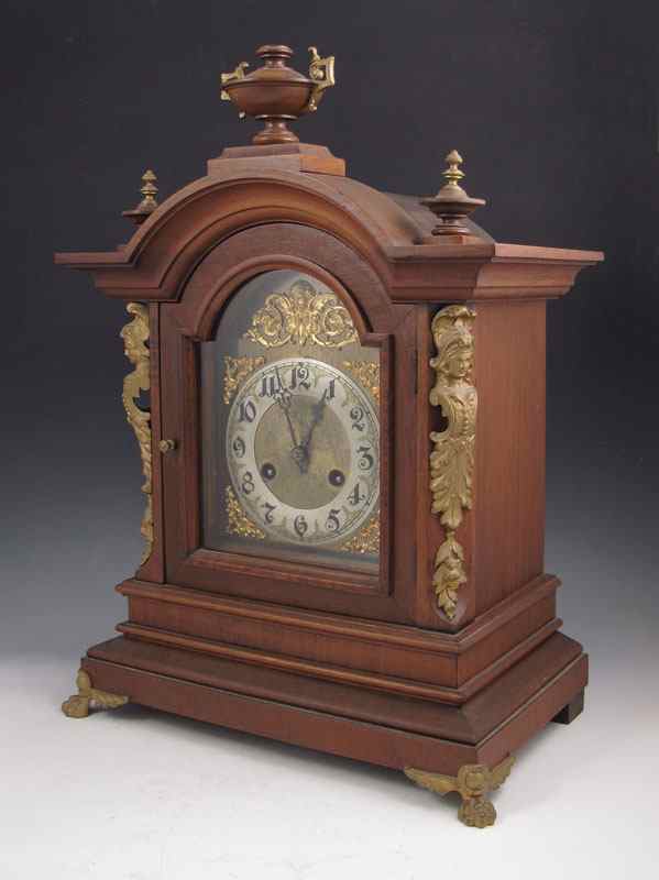 Appraisal: JUNGHANS WALNUT MANTLE CLOCK German walnut case with urn finials