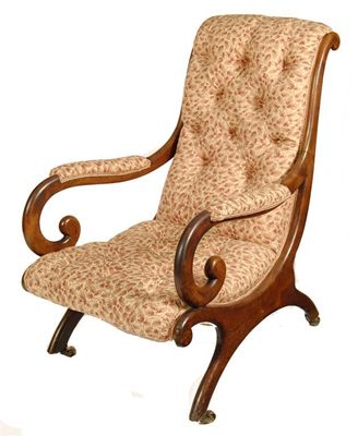 Appraisal: A Victorian mahogany open arm chair with scroll arms and