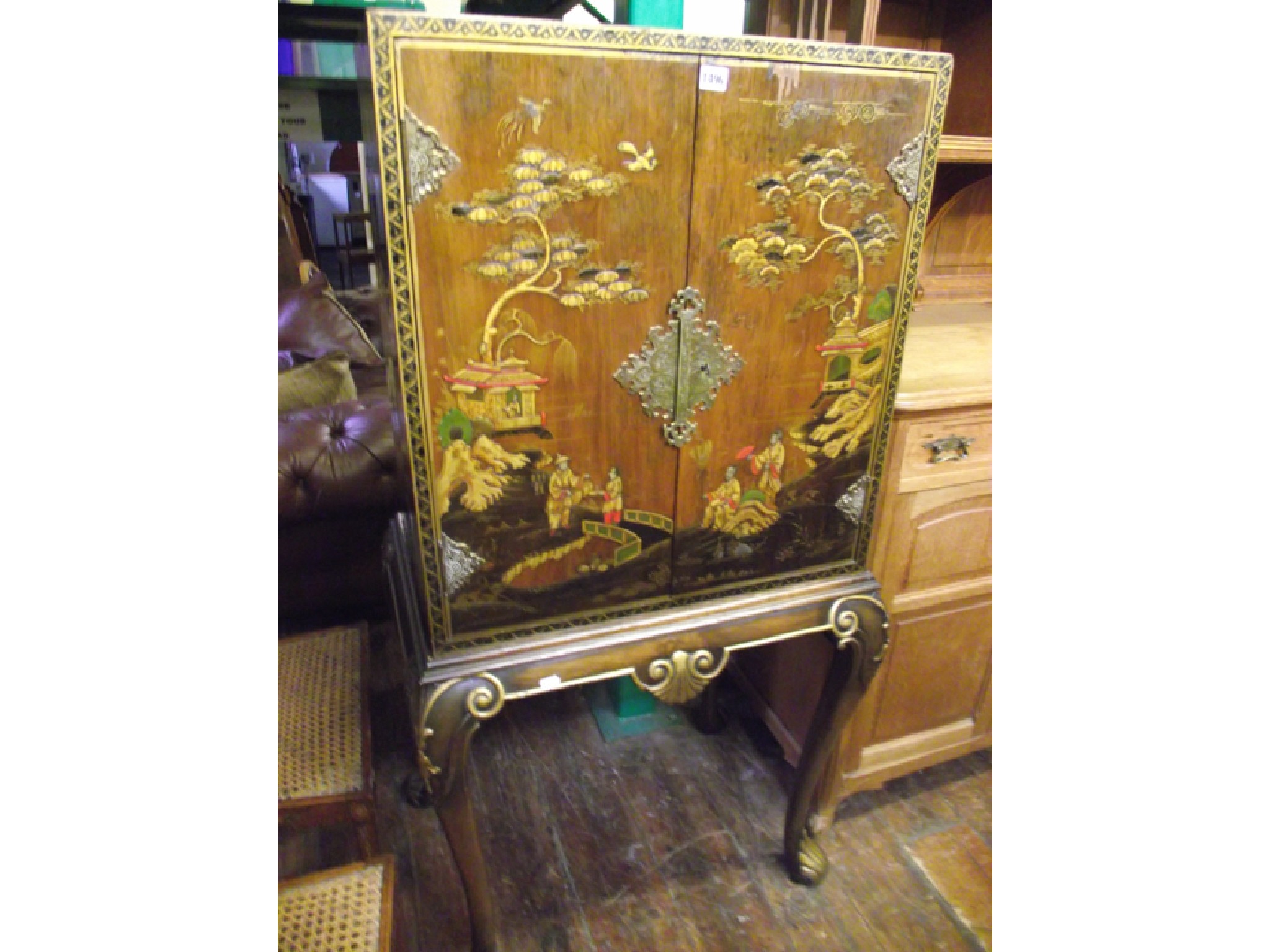 Appraisal: A s chinoiserie cocktail cabinet on stand the walnut veneer