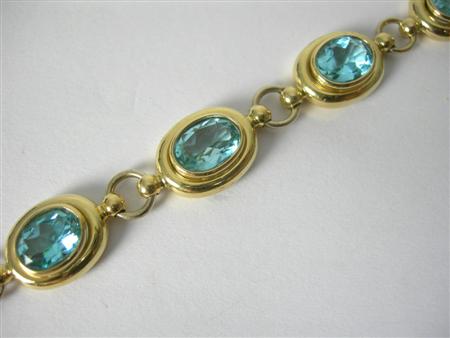 Appraisal: An ct gold mounted blue topaz set bracelet composed of