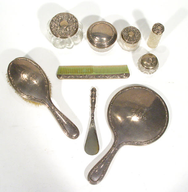 Appraisal: Silver hand mirror brush comb and hair pot all embossed