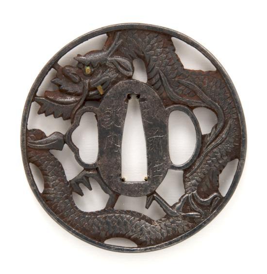 Appraisal: An Iron Dragon Form Tsuba Echizen Ju Kinai signed with