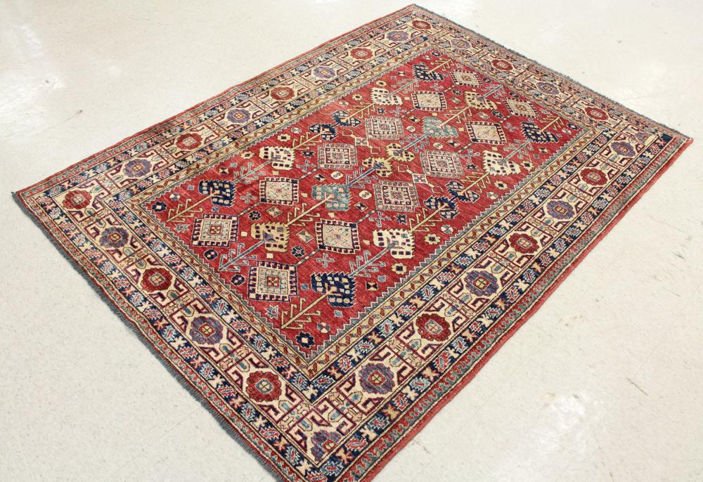 Appraisal: HAND KNOTTED ORIENTAL RUG Pakistani-Caucasian overall geometric design on red