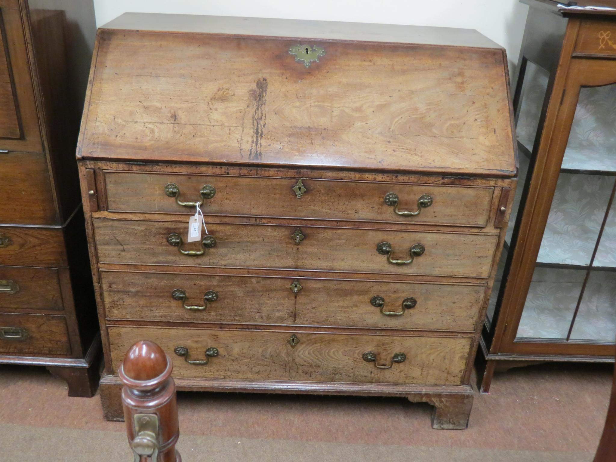 Appraisal: A George III mahogany bureau fall-front enclosing an arrangement of