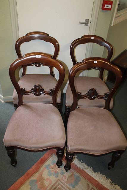 Appraisal: A SET OF FOUR VICTORIAN MAHOGANY BALLOON BACK DINING CHAIRS