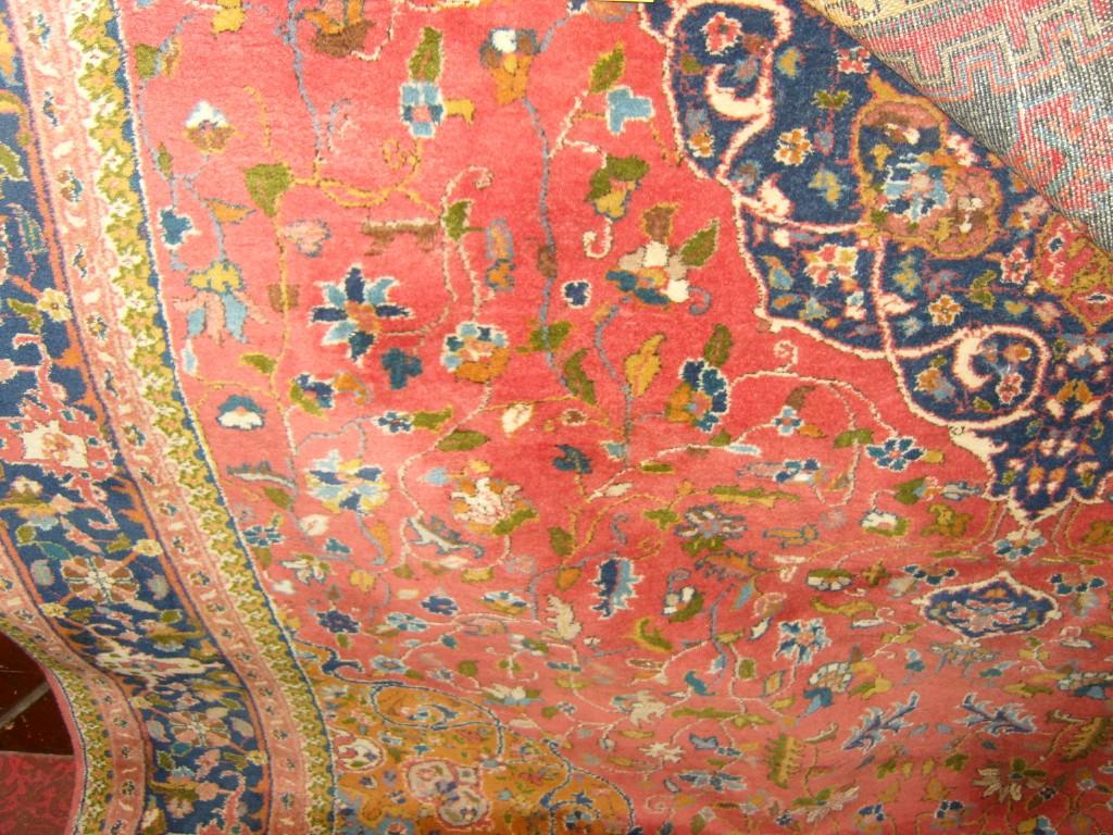 Appraisal: A pink ground wool rug in the Persian style with