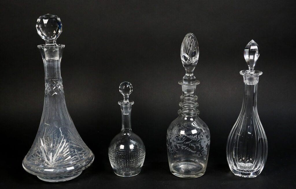 Appraisal: CRYSTAL DECANTERS crystal wine decanters with Baccarat acid mark on