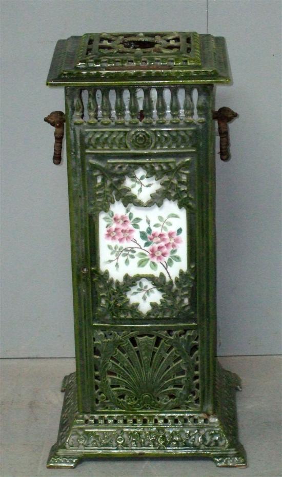 Appraisal: Veritas cast iron and green enamelled oil stove with twin