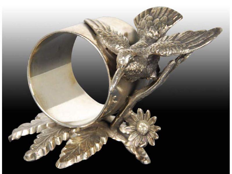 Appraisal: Hummingbird In Flight Figural Napkin Ring Description Manufacturer's name is