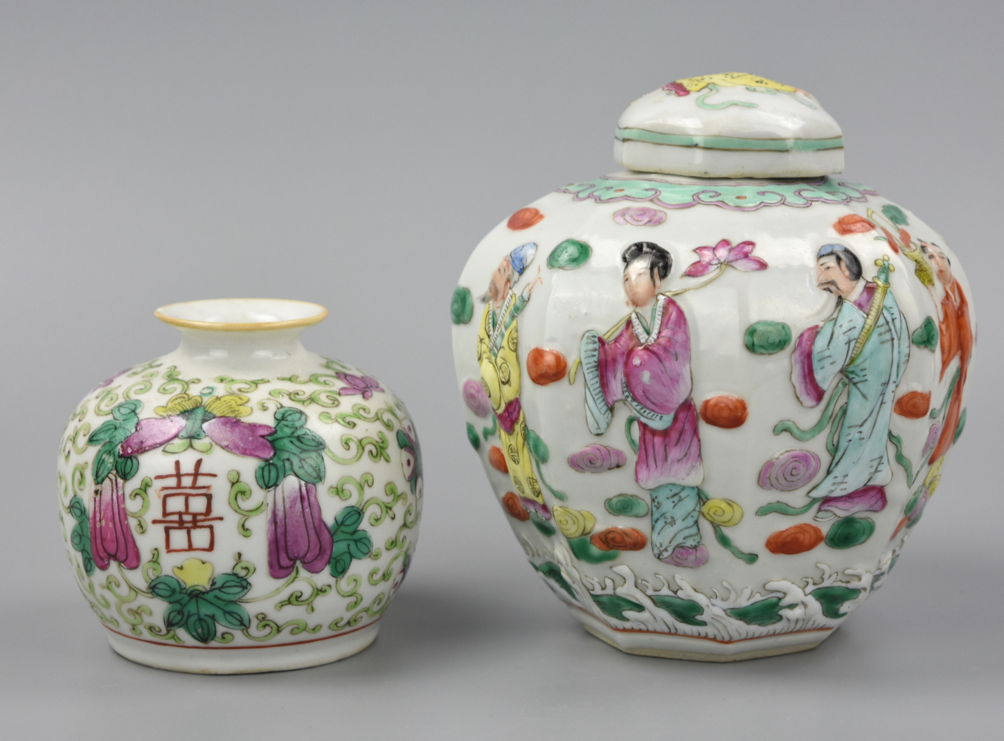 Appraisal: TWO FAMILLE ROSE JARS W RELIEF FIGURES TH C Chinese