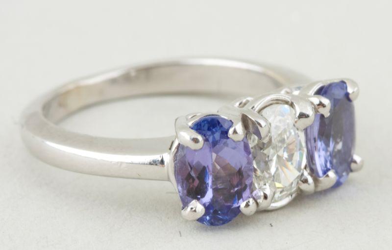 Appraisal: KT Diamond and Blue Stone Ring white gold three stone