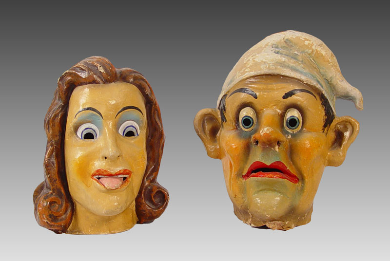 Appraisal: PAIR VINTAGE PAPER MACHE COSTUME HEADS To include Man's head