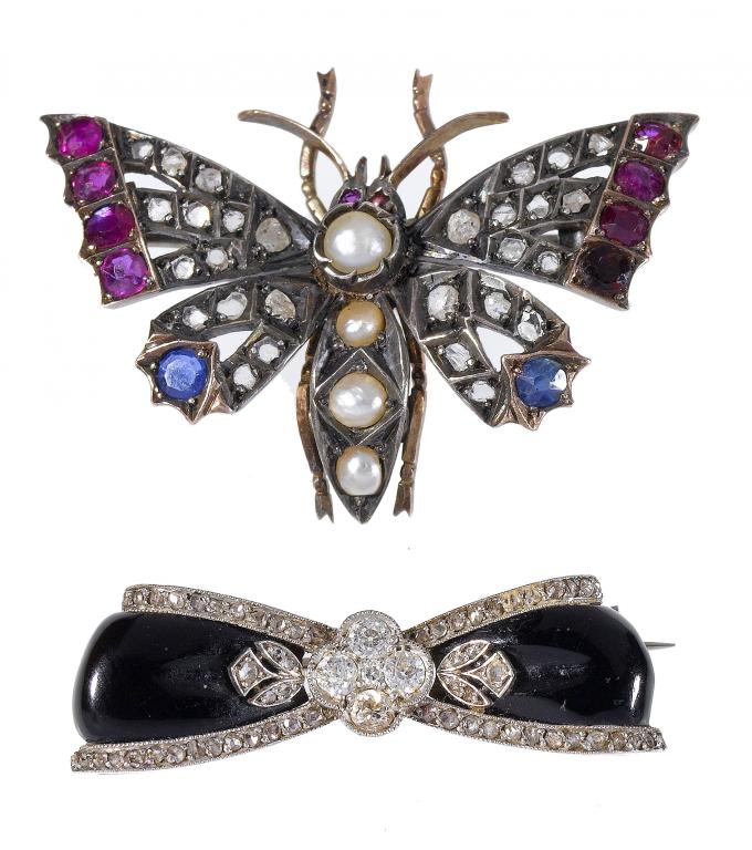 Appraisal: AN ART DECO DIAMOND AND ONYX BOW BROOCH c a