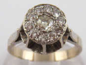 Appraisal: A French hallmarked carat gold diamond cluster ring approx mm