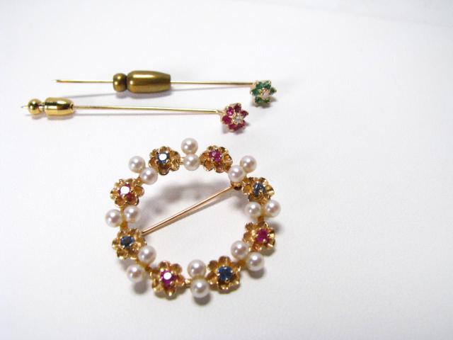 Appraisal: Grouping of three pins set with rubies sapphires and emeralds