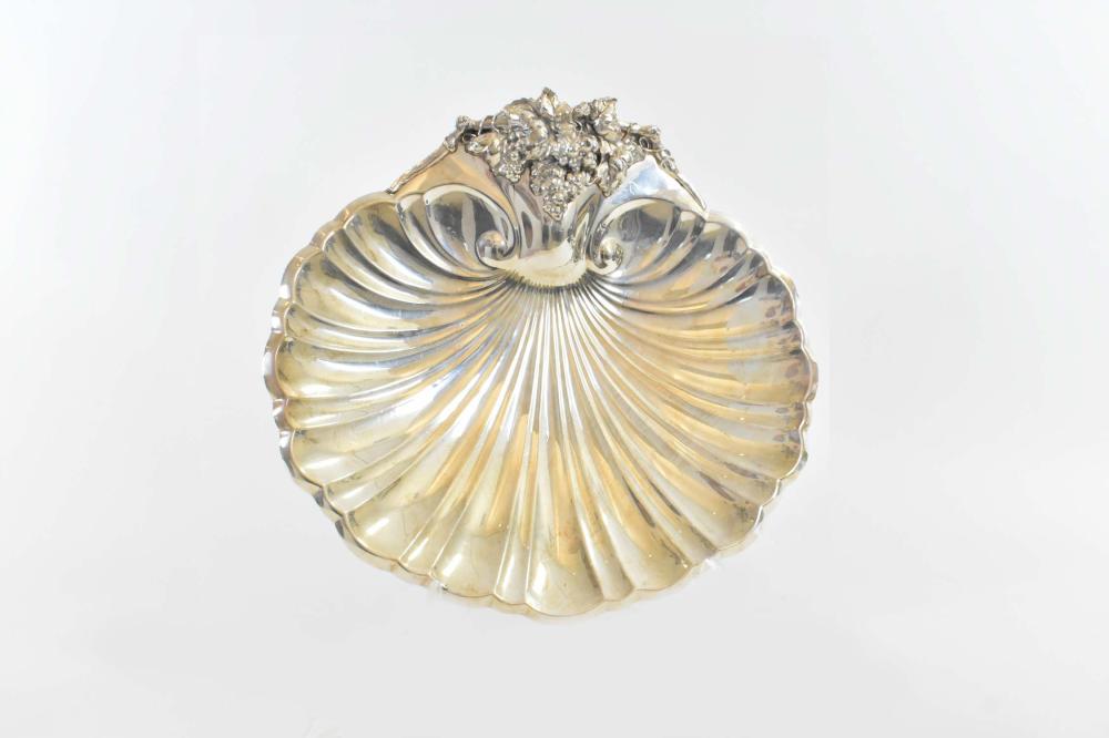 Appraisal: AMERICAN SILVER PLATE SHELL-SHAPED GRAPE DISHReed Barton The large scalloped