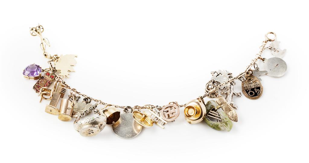 Appraisal: A multi-gem set charm bracelet the bracelet composed of fancy