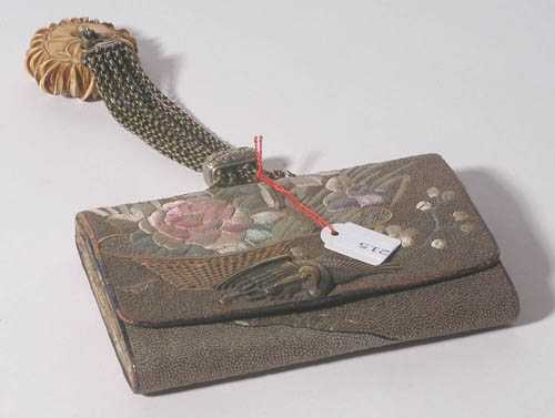 Appraisal: TOBACCO POUCH WITH MANJU Japan th century x cm On