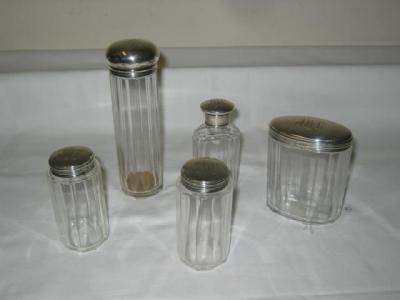 Appraisal: A SET OF THREE EDWARDIAN TOILET BOTTLES the panelled glass