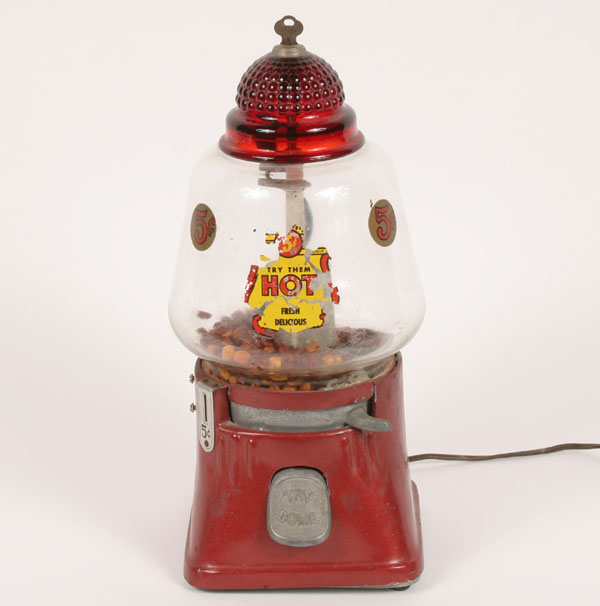 Appraisal: Hot peanut dispenser with ruby dome enameled base and paper